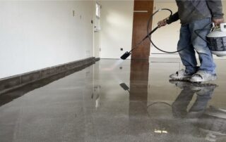 This image shows a man applying polish to the floor.